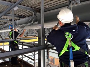 Installation de plomberie en hauteur avec échaffaudage à Joliette - Plomberie le Plomb